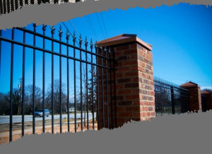 wrought iron fence with brick posts